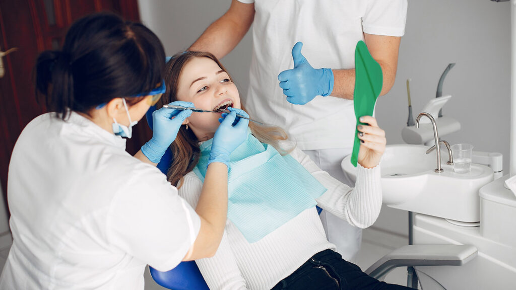 Dentist performing root canal in Greater Noida